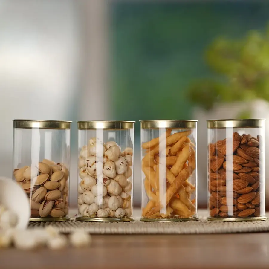 Clear tins filled with dry fruits